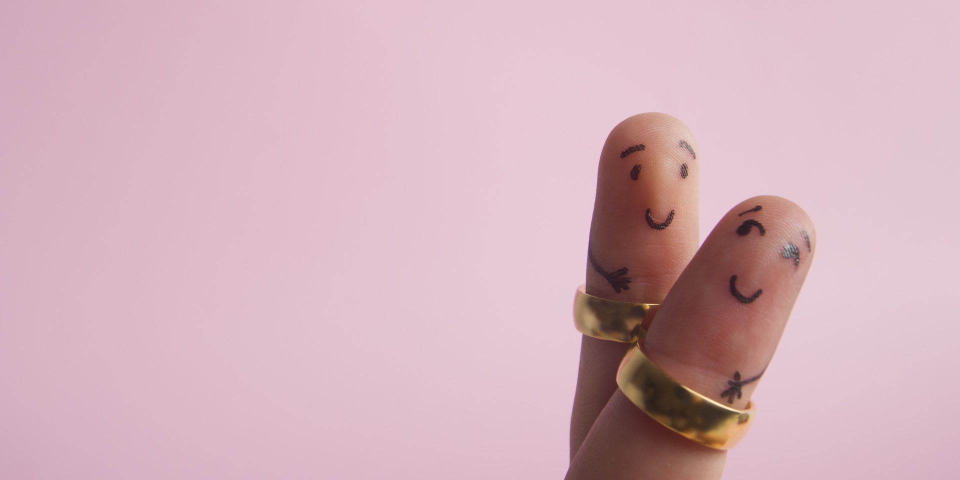 Painted happy family fingers smiley in love with marriage wedding rings.